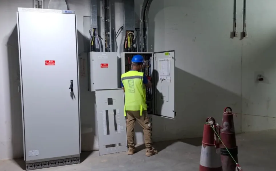 Technician working on an electrical panel