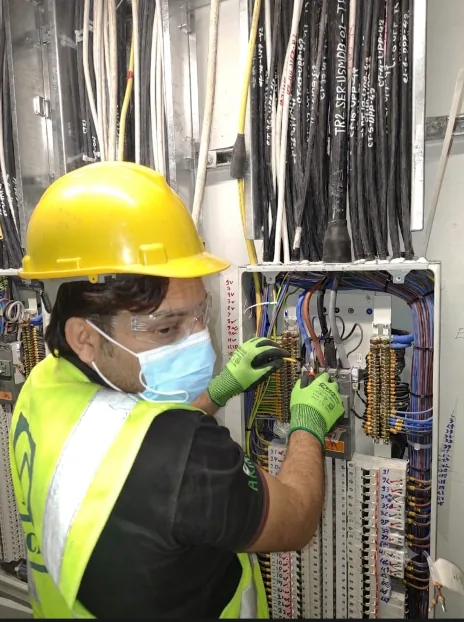 Technician inspecting electrical equipment